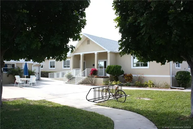 a room with pool table and chairs