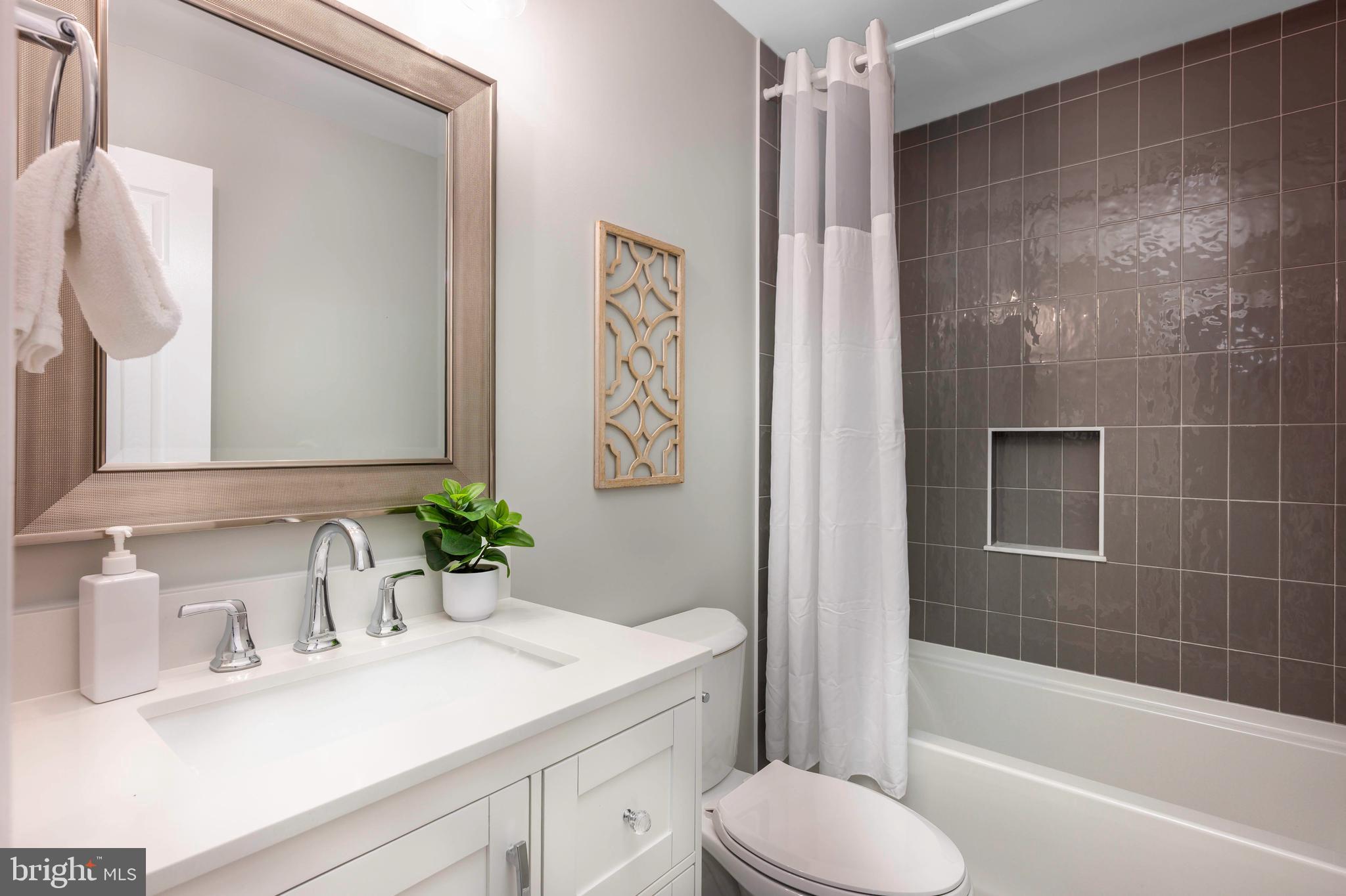 7858 Tick Neck Road Pasadena, MD 21122 - Photo 18 of 43 Newly Renovated Bathrom w/ custom tile