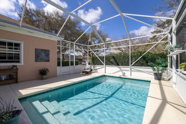 a view of a house with a backyard