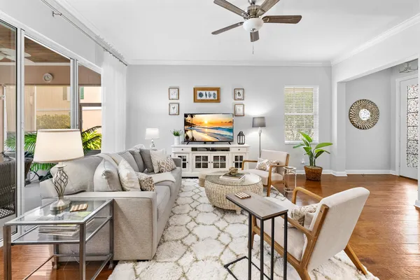 a living room with fireplace furniture and a flat screen tv