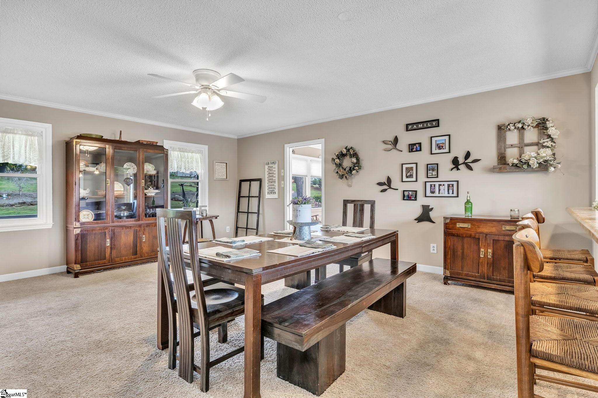 143 Chestnut Lake Drive Inman, SC 29349 - Photo 10 of 27 This was originally was the living room. The current owner is using it as a dining area for gatherings.