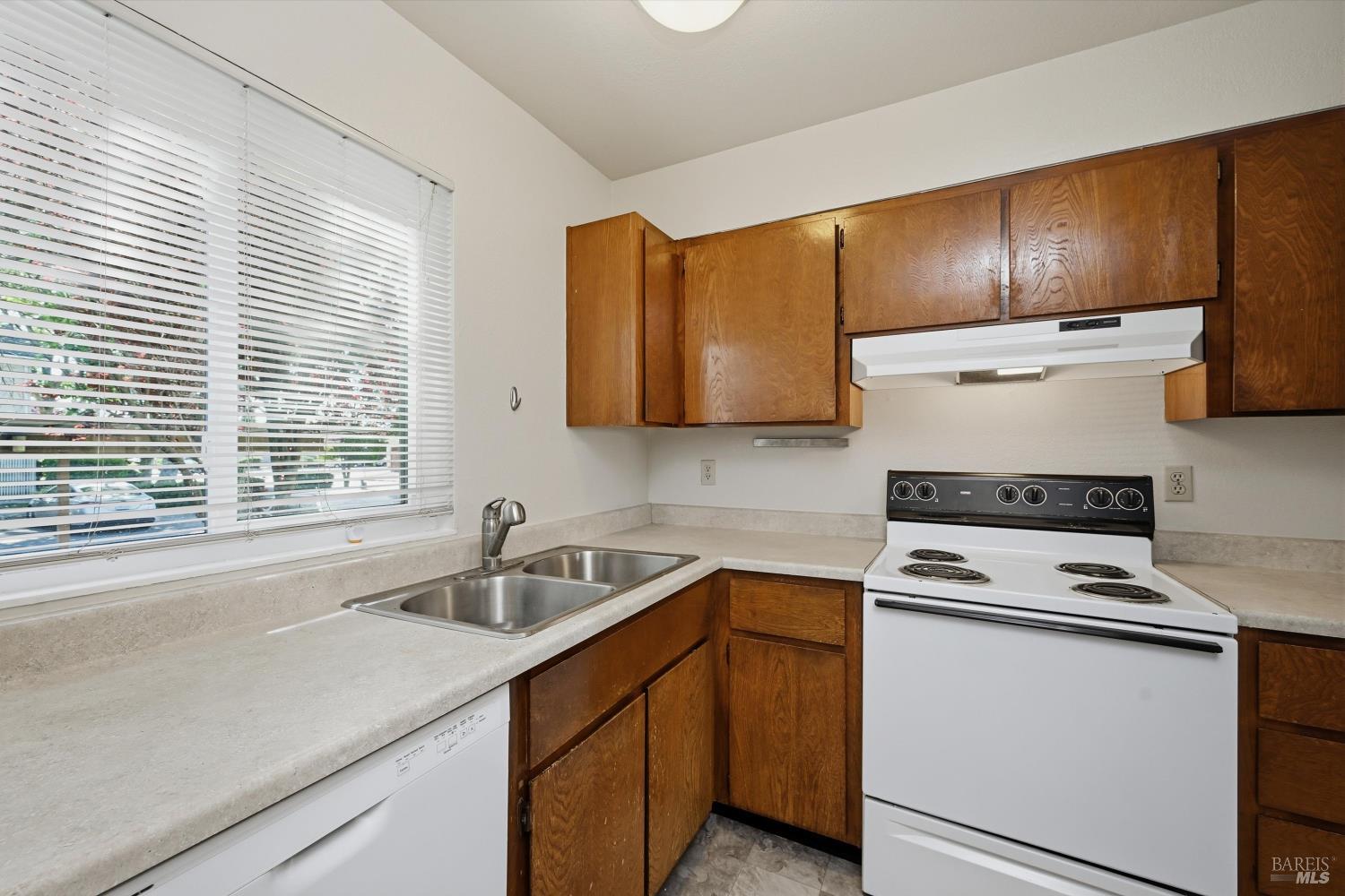 498 Santa Alicia Drive Rohnert Park, CA 94928 - Photo 2 of 18 a kitchen with stainless steel appliances a stove a sink a microwave and cabinets