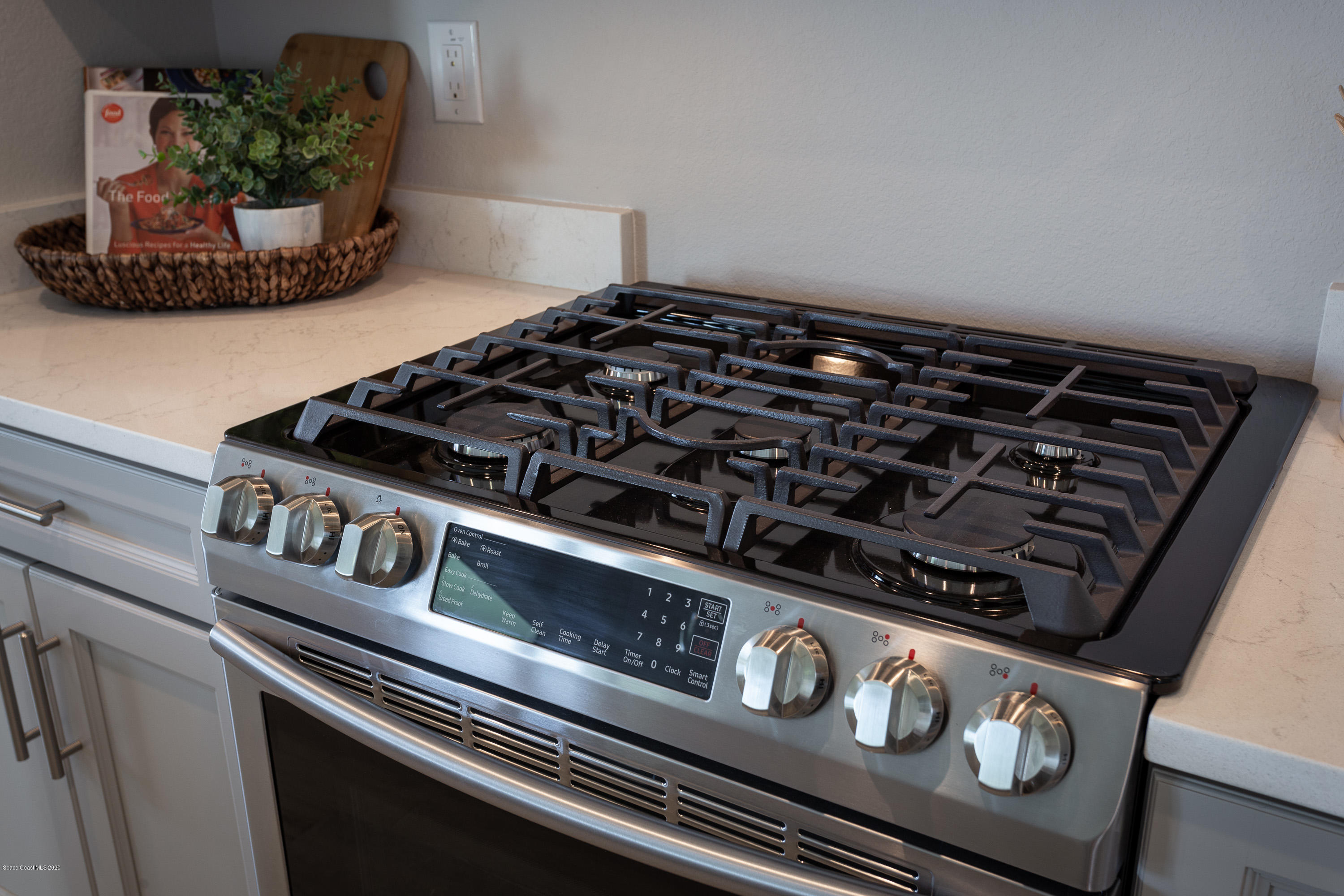 4435 Negal Circle Melbourne, FL 32901 - Photo 14 of 33 a close up of a stove top oven sitting on a counter