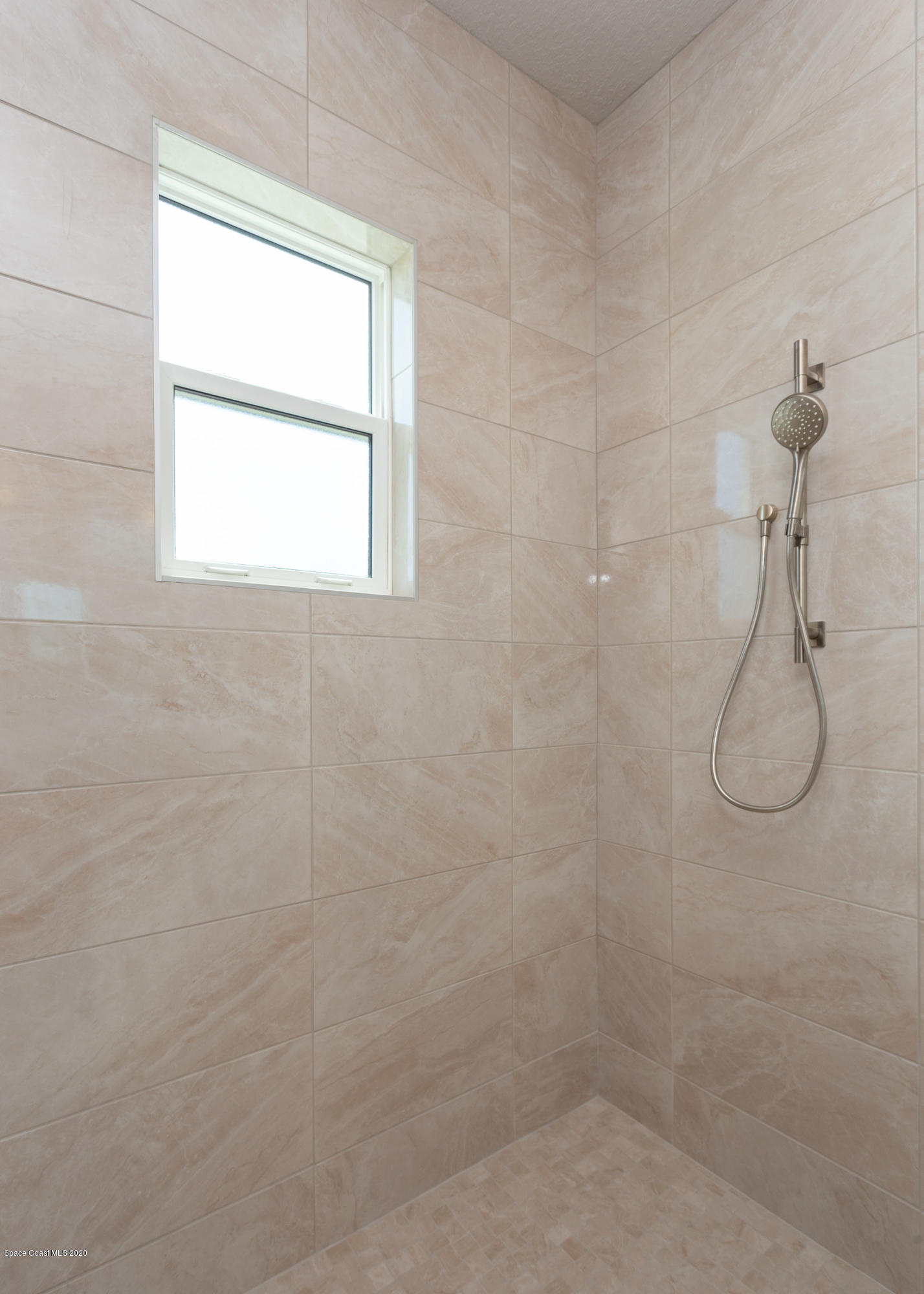 4435 Negal Circle Melbourne, FL 32901 - Photo 22 of 33 a bathroom with a window