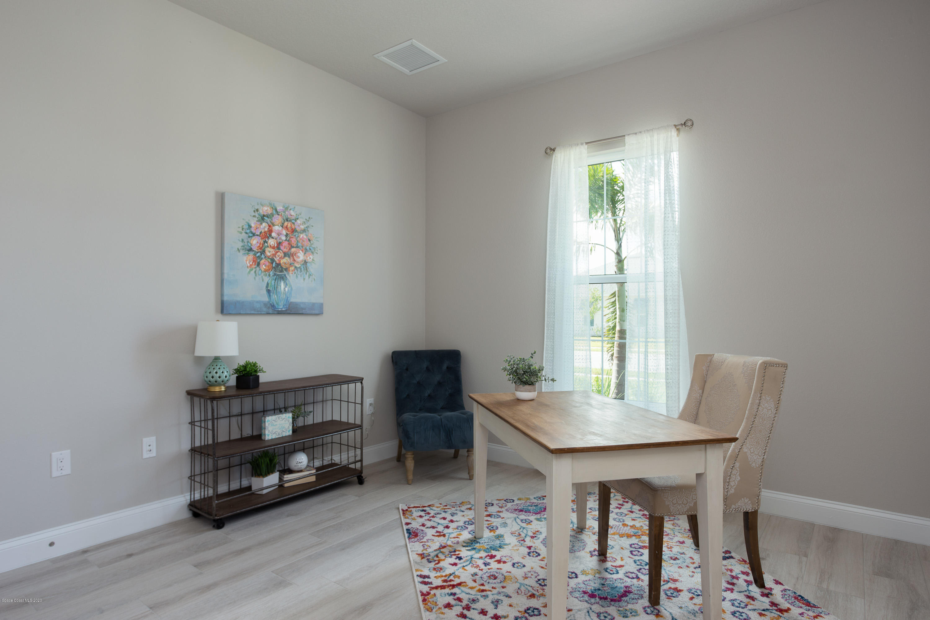 4435 Negal Circle Melbourne, FL 32901 - Photo 24 of 33 a view of a room with furniture window and wooden floor