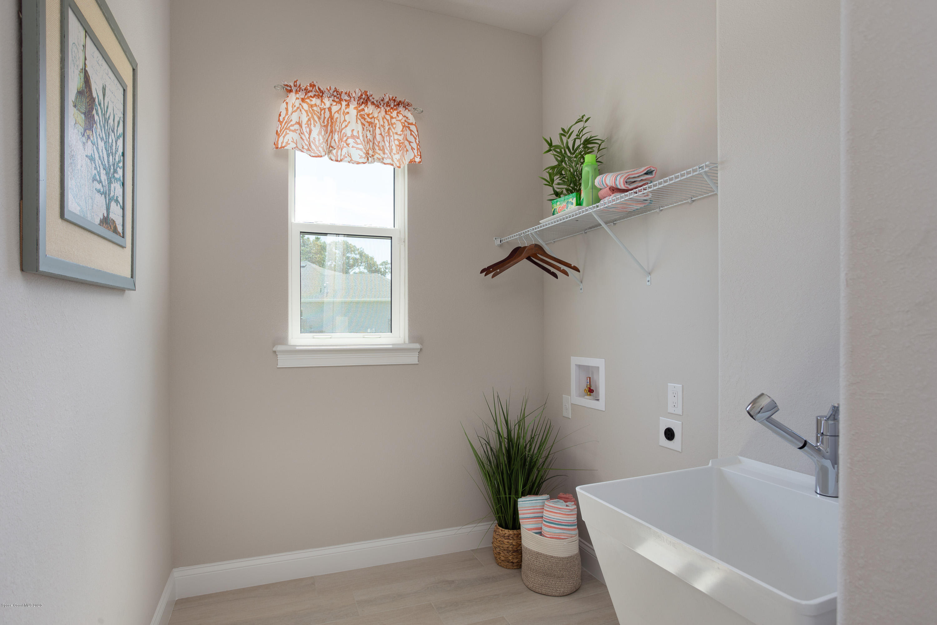 4435 Negal Circle Melbourne, FL 32901 - Photo 27 of 33 a white bath tub sitting next to a window