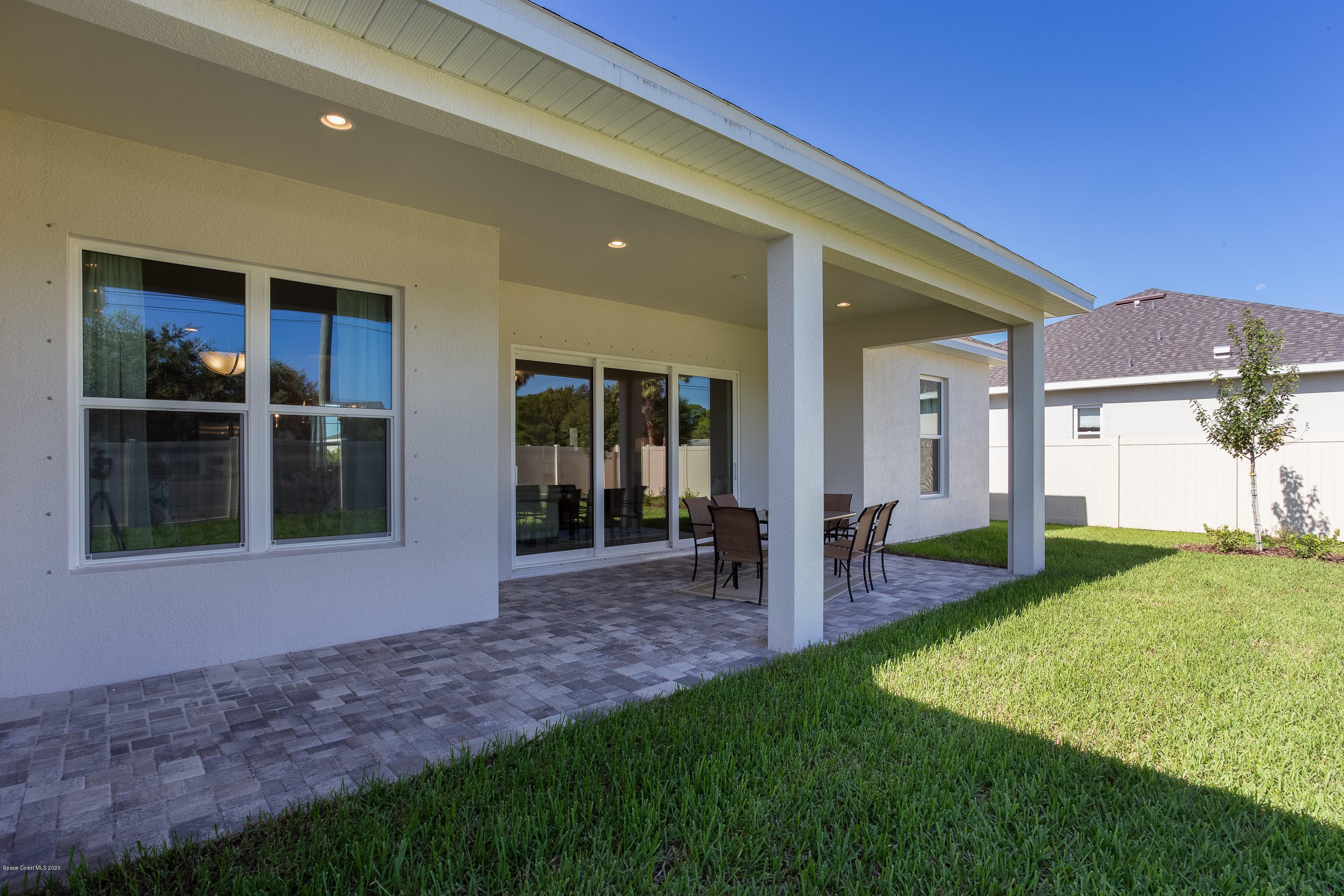 4435 Negal Circle Melbourne, FL 32901 - Photo 29 of 33 a view of an house with backyard porch and garden