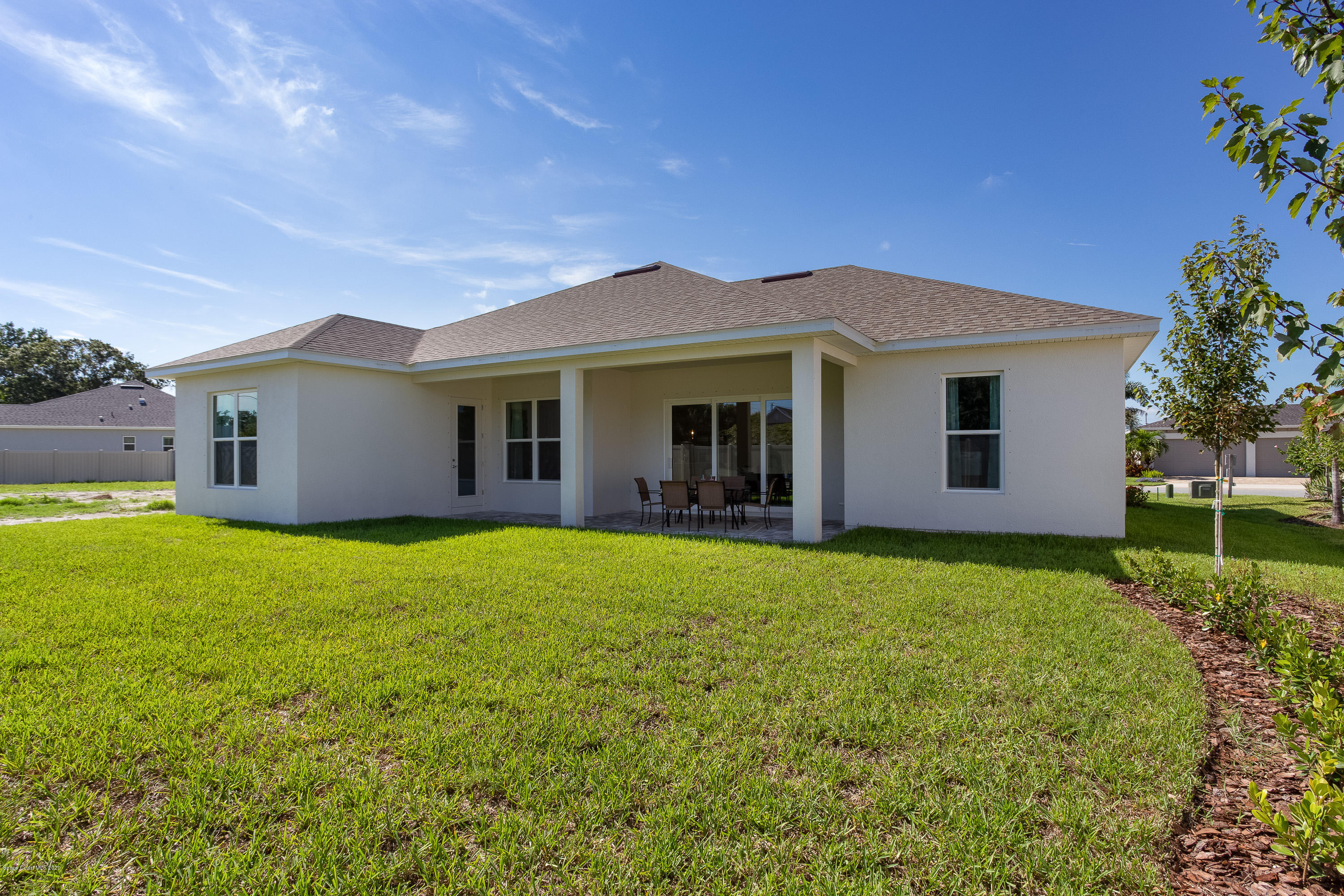 4435 Negal Circle Melbourne, FL 32901 - Photo 30 of 33 a view of a house with backyard and garden