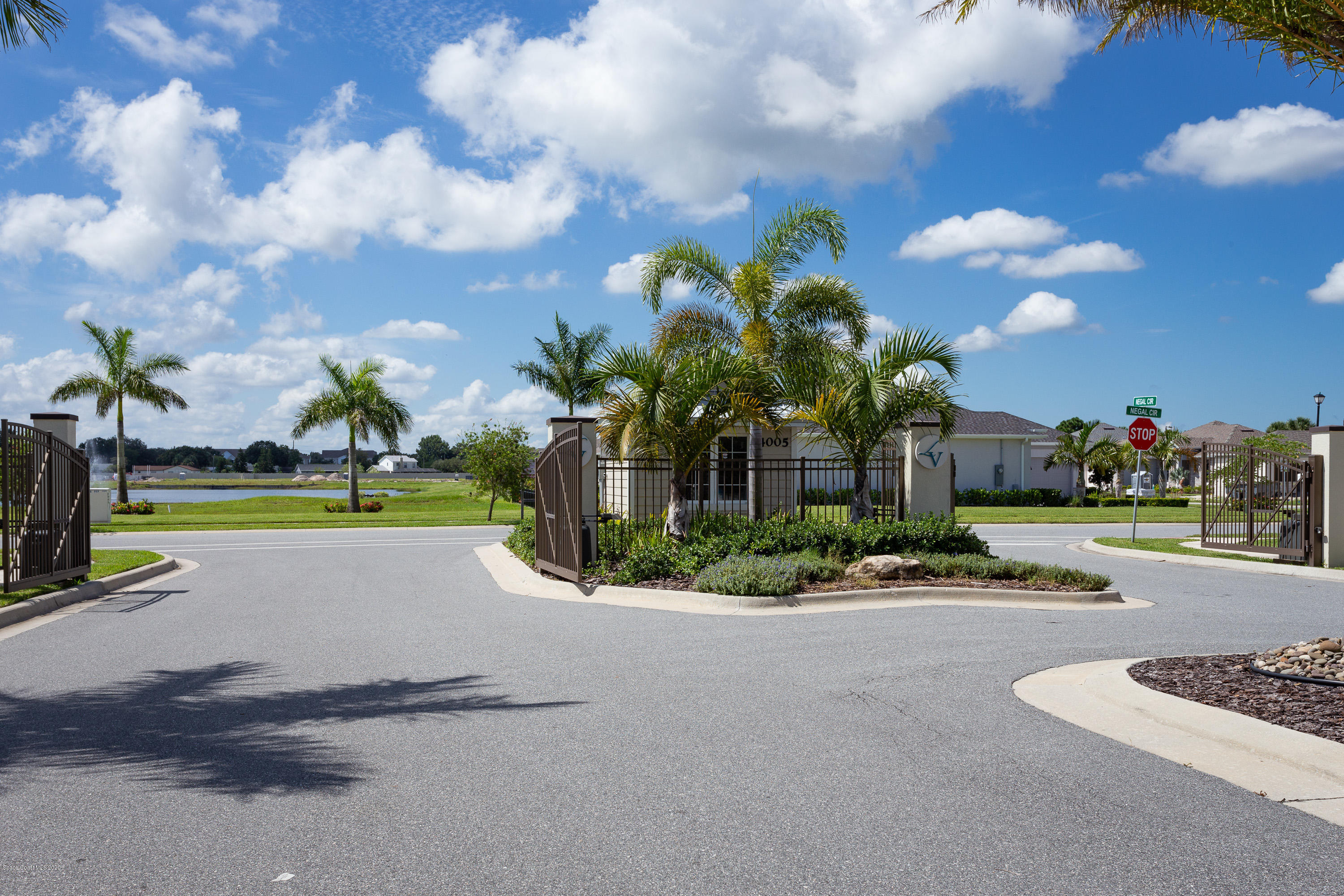 4435 Negal Circle Melbourne, FL 32901 - Photo 32 of 33 a view of a house with a swimming pool and a yard