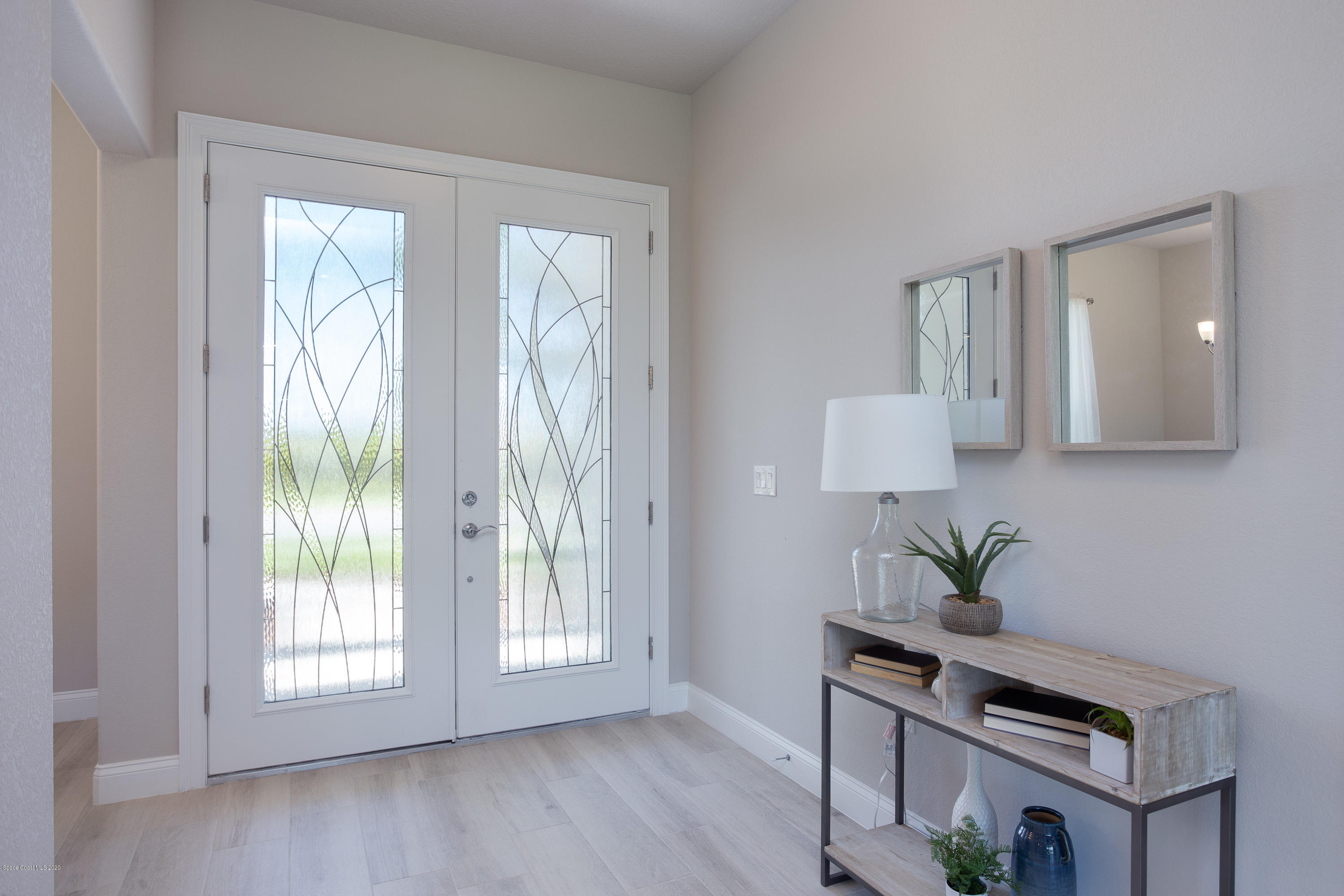 4435 Negal Circle Melbourne, FL 32901 - Photo 5 of 33 a view of an entryway with wooden floor