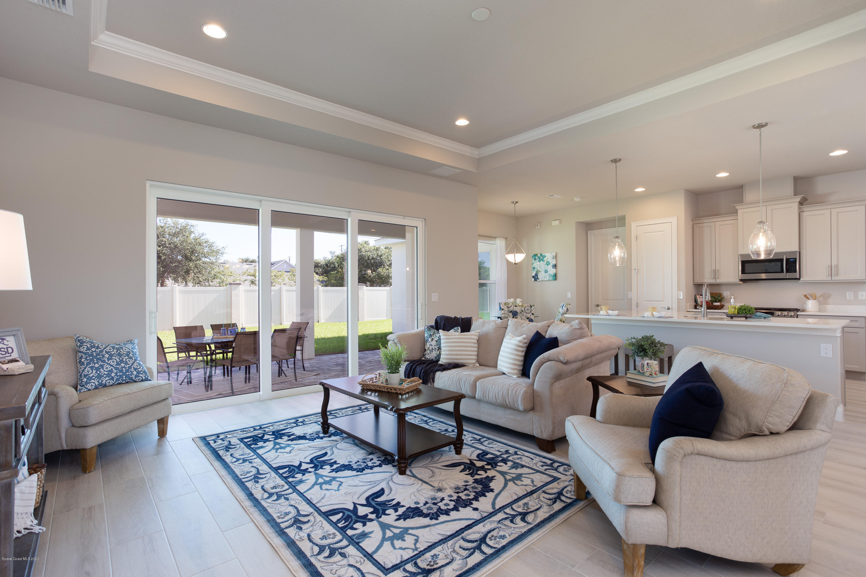 4435 Negal Circle Melbourne, FL 32901 - Photo 8 of 33 a living room with furniture and a large window