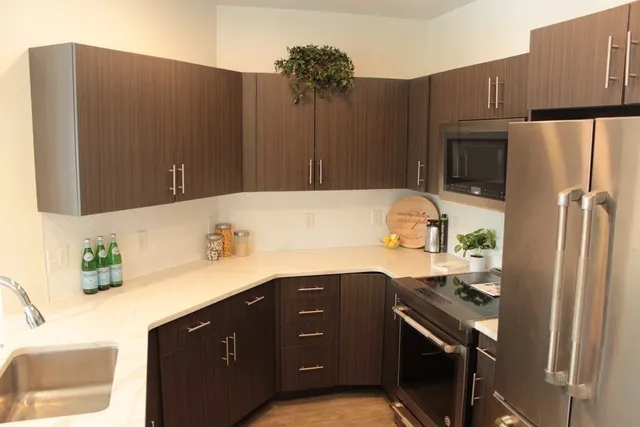 a kitchen with a sink and a refrigerator