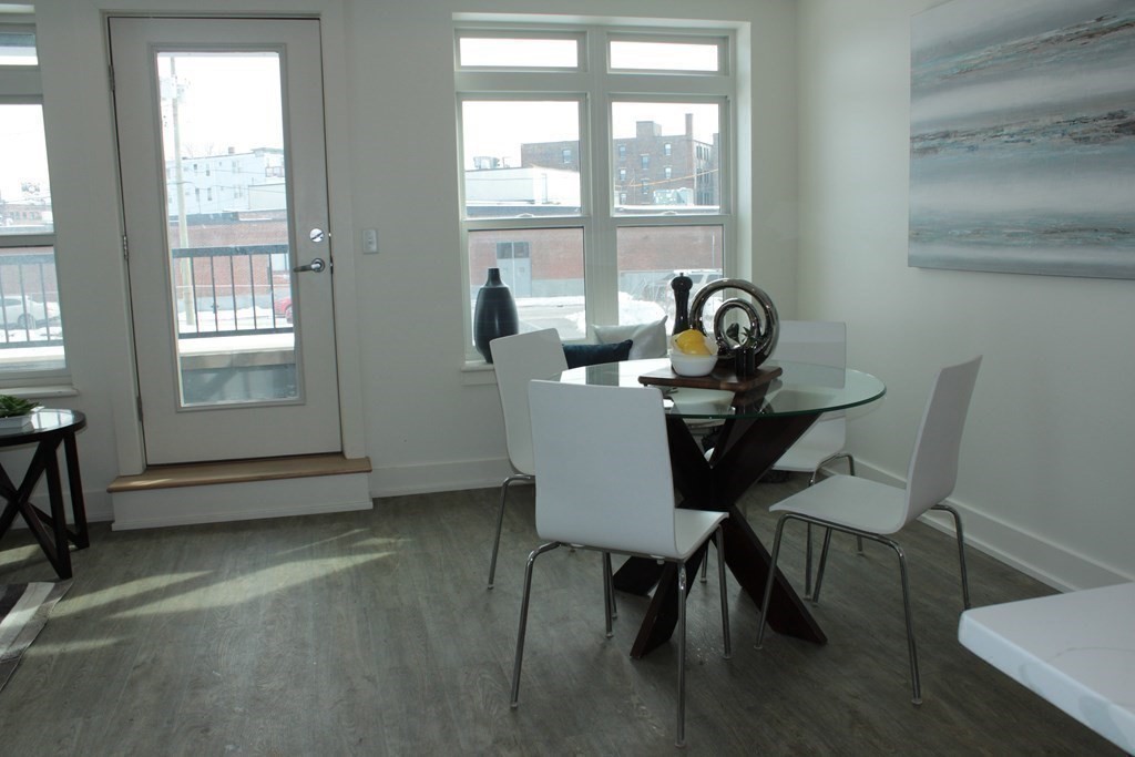 20 Penniman Road, Unit 108 Boston, MA 02134 - Photo 5 of 14 a view of a workspace with furniture and a window