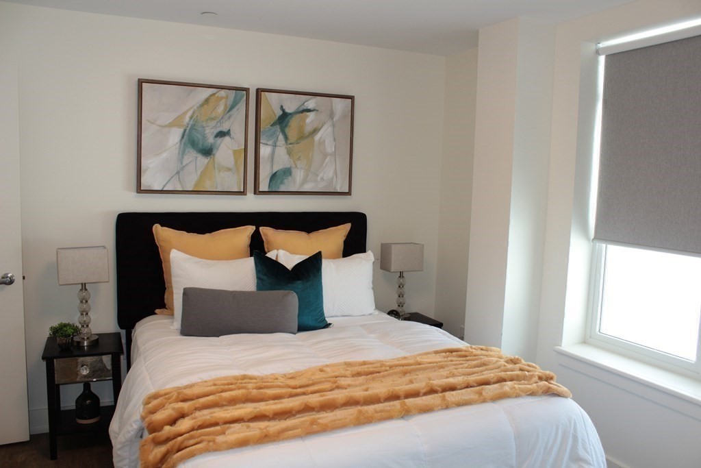 20 Penniman Road, Unit 108 Boston, MA 02134 - Photo 6 of 14 a bedroom with a bed and window