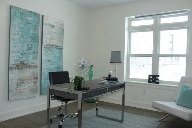 a workspace with furniture and a window