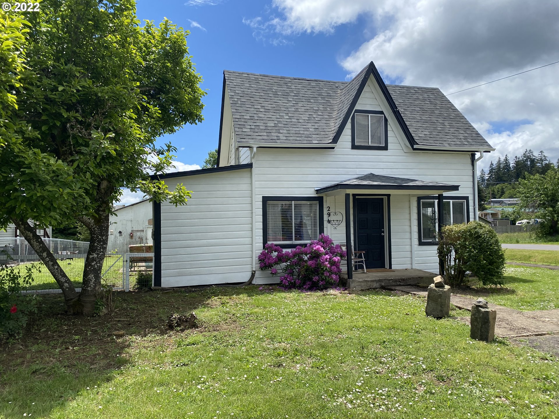 296 Applegate Street Yoncalla, OR 97499 - Photo 1 of 18 a front view of a house with garden