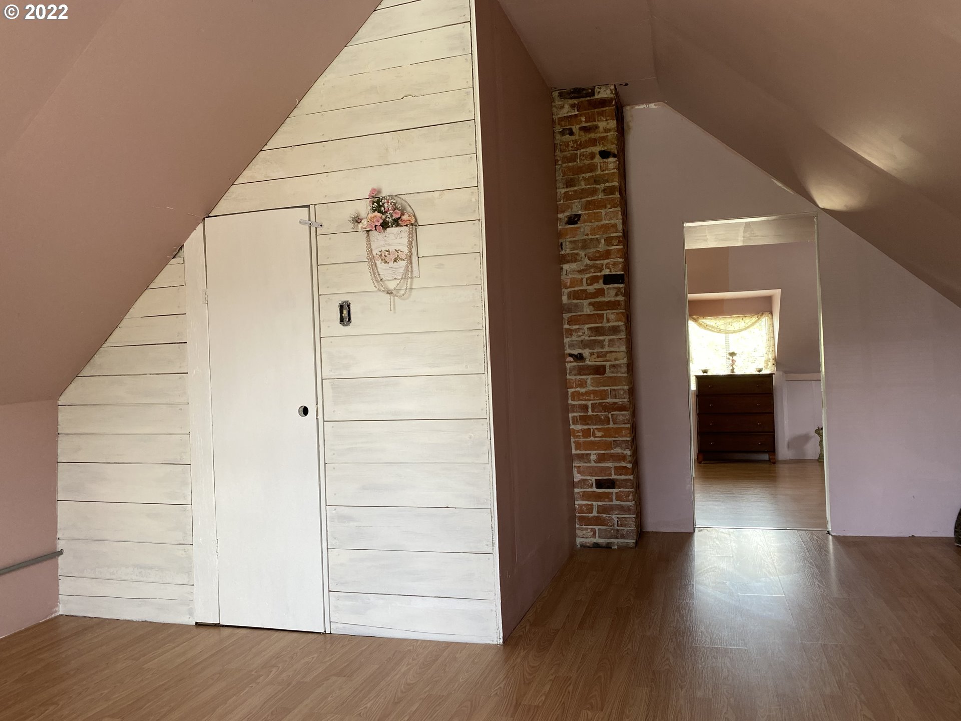 296 Applegate Street Yoncalla, OR 97499 - Photo 14 of 18 a view of a hallway with stairs and wooden floor