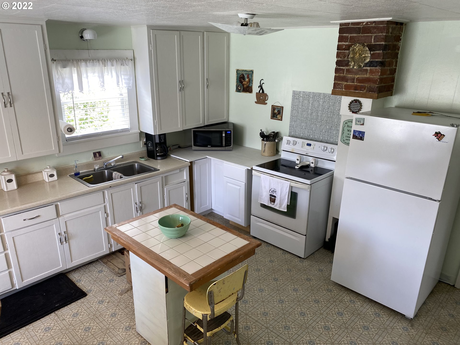 296 Applegate Street Yoncalla, OR 97499 - Photo 16 of 18 a kitchen with a sink stove and refrigerator