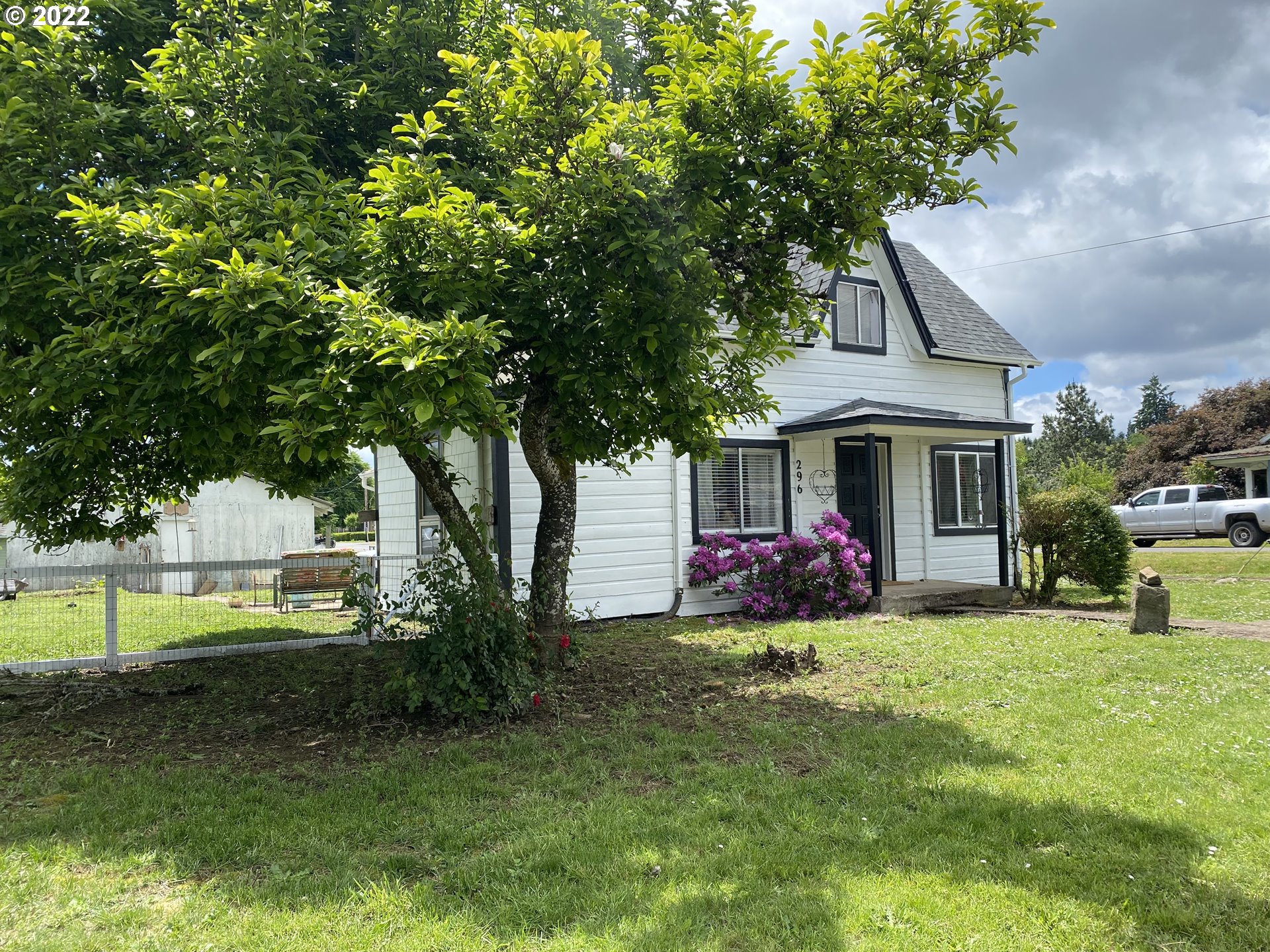 296 Applegate Street Yoncalla, OR 97499 - Photo 18 of 18 a view of a house with a yard and sitting area