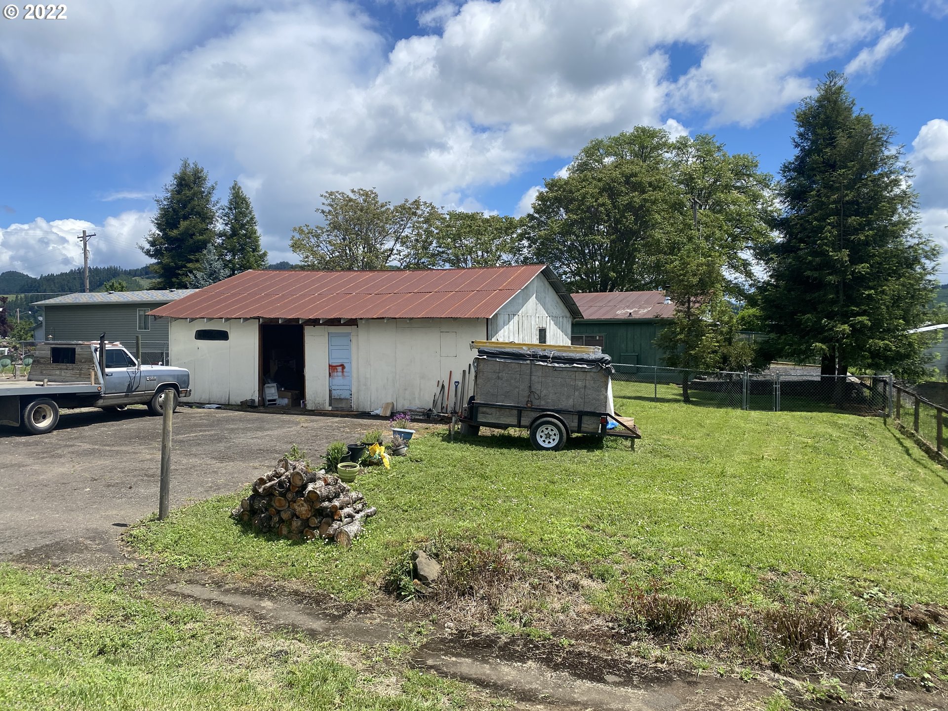 296 Applegate Street Yoncalla, OR 97499 - Photo 4 of 18 a front view of a house with garden