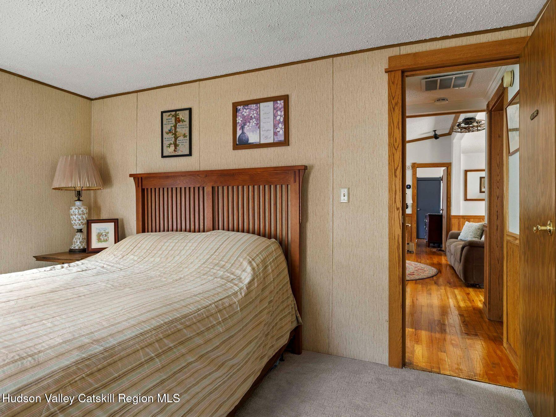382 Cairo Junction Road Catskill, NY 12414 - Photo 29 of 38 a bedroom with a bed and a painting on the wall