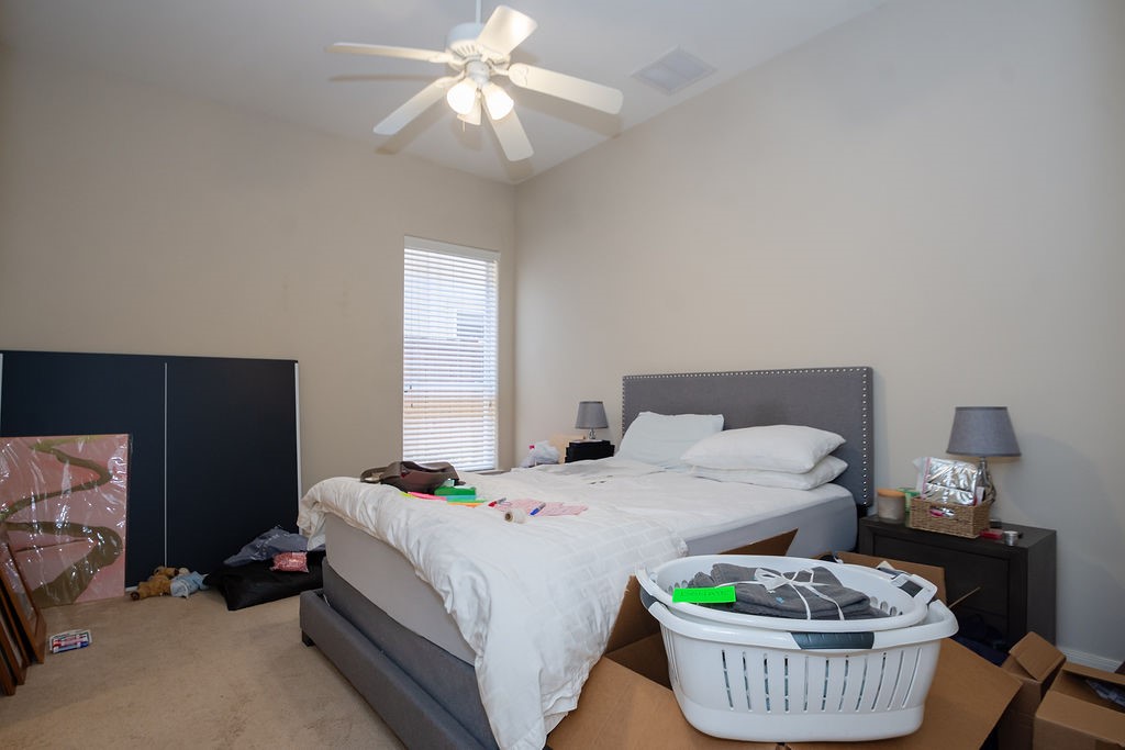 3011 Bonnebridge Way Boulevard Houston, TX 77082 - Photo 25 of 45 a bedroom with a bed and a table in it
