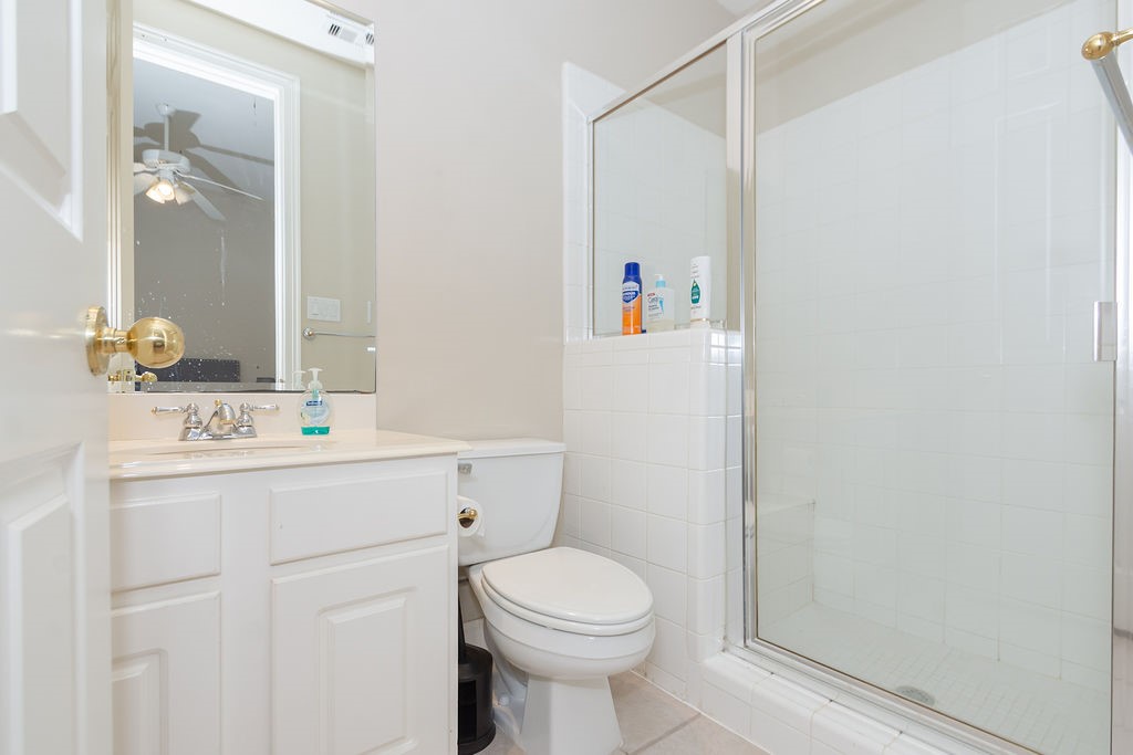3011 Bonnebridge Way Boulevard Houston, TX 77082 - Photo 26 of 45 a bathroom with a sink a toilet and a mirror