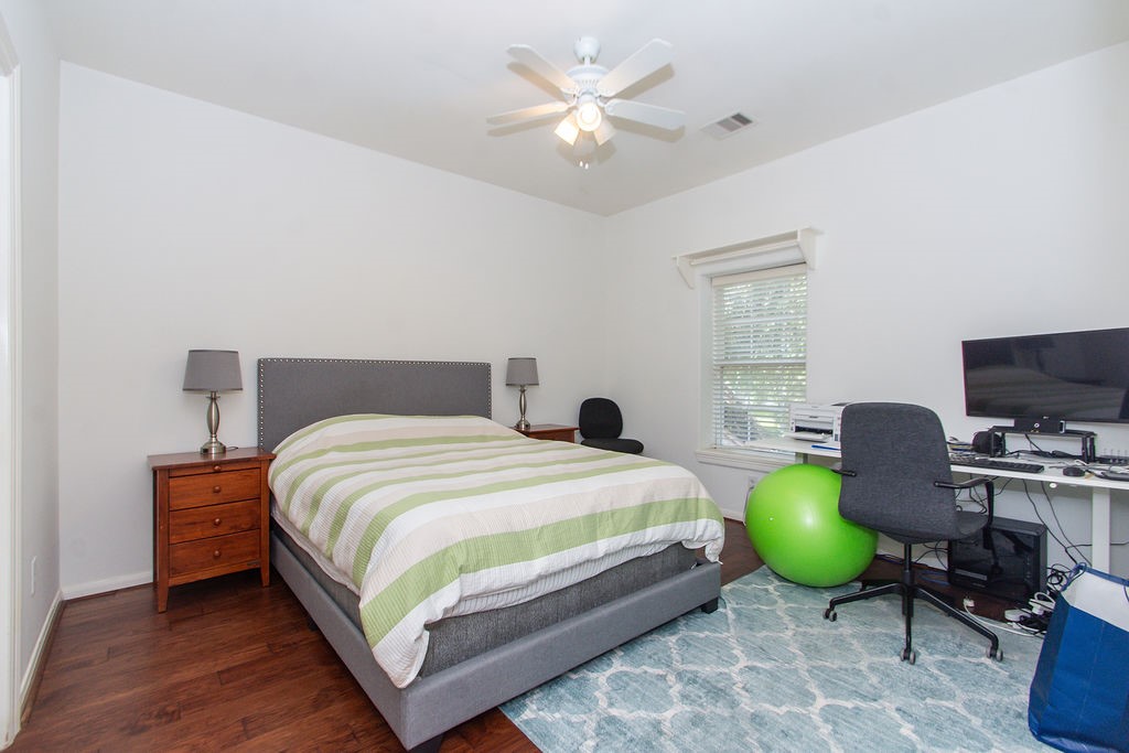 3011 Bonnebridge Way Boulevard Houston, TX 77082 - Photo 32 of 45 a bedroom with a bed window and a chair