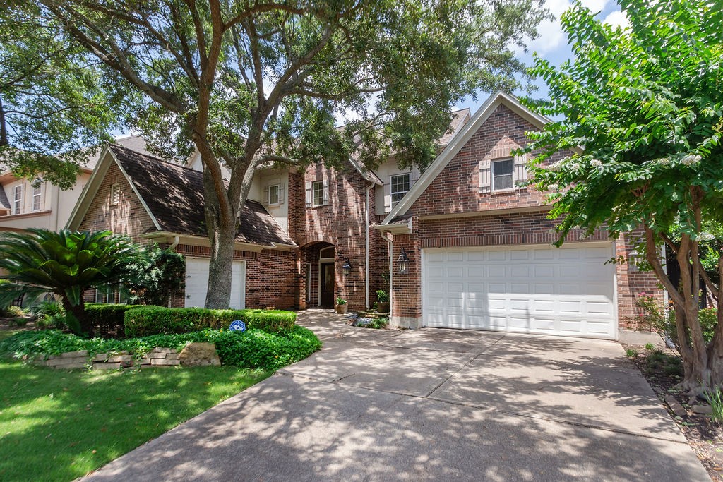 3011 Bonnebridge Way Boulevard Houston, TX 77082 - Photo 45 of 45 a front view of a house with a yard and garage