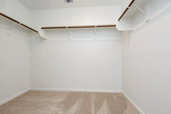 a view of an empty walk in closet