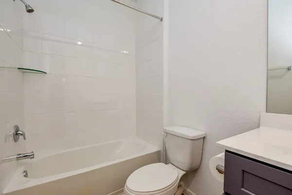 a bathroom with a sink a toilet and a bathtub