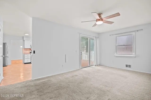 a view of an empty room with a window