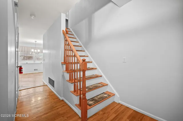 a view of entryway with wooden floor