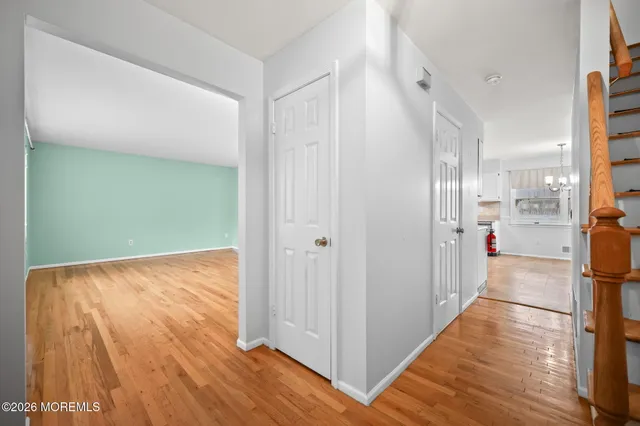 a view of a kitchen from the hallway