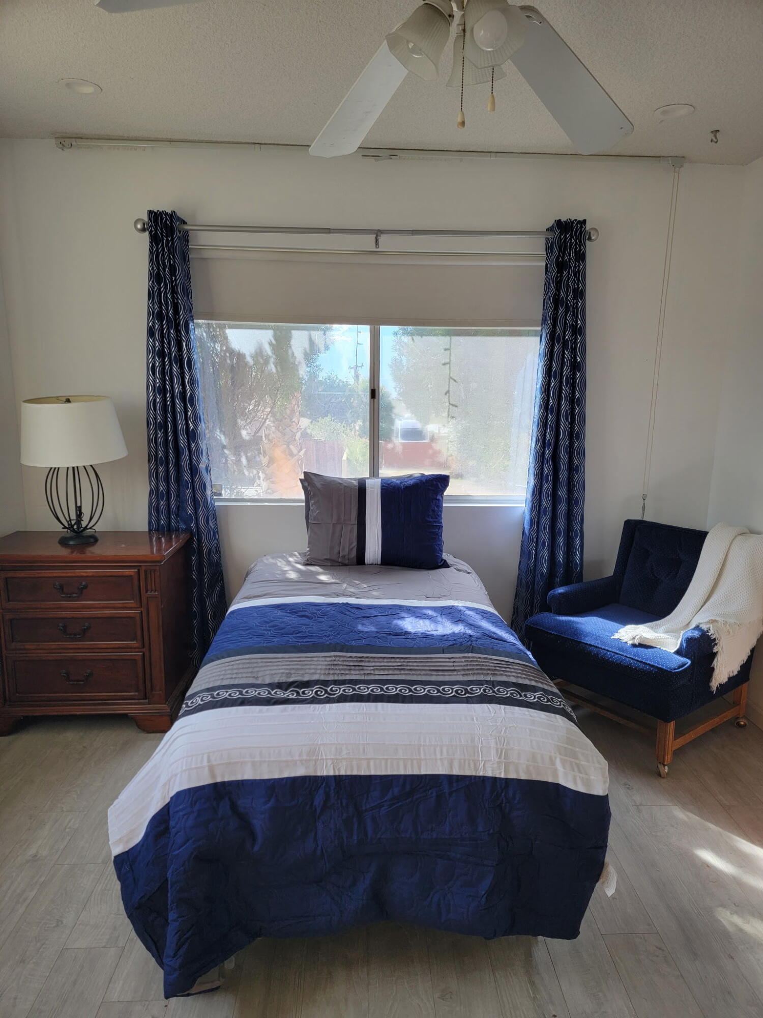 66630 San Marcus Road Desert Hot Springs, CA 92240 - Photo 1 of 5 a bedroom with a bed and window