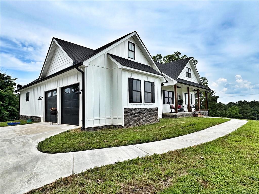 a front view of a house with a yard and garage