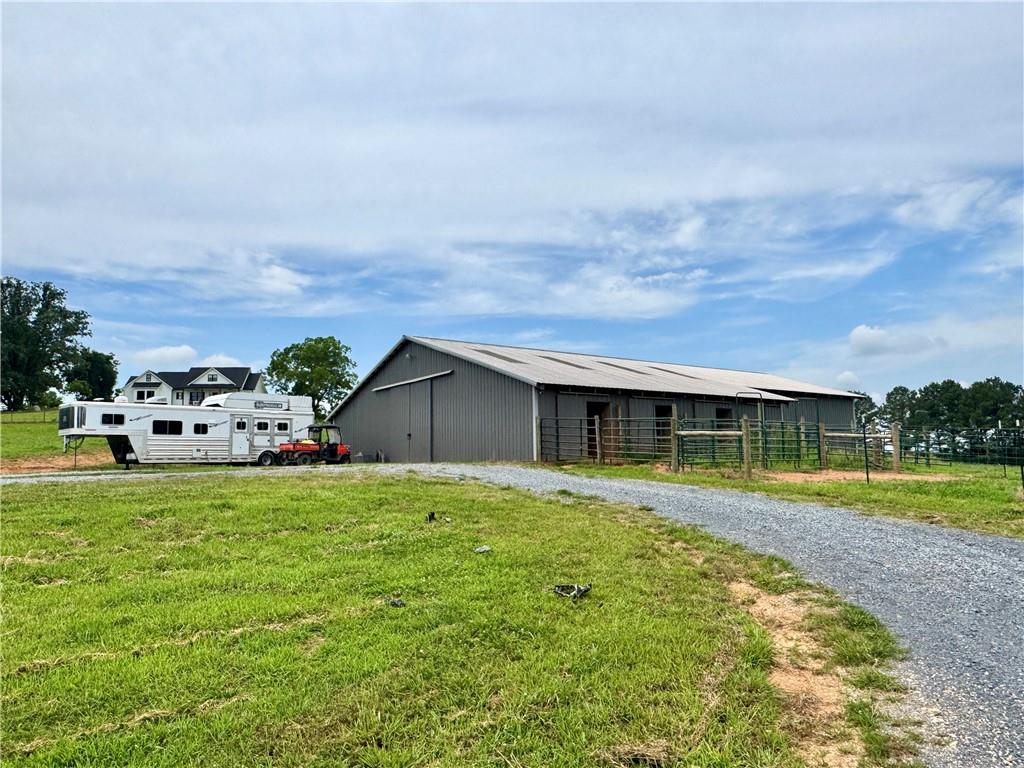 455 Poarch Farm Road Northeast Ranger, GA 30734 - Photo 15 of 93 a view of a house with a yard and garage
