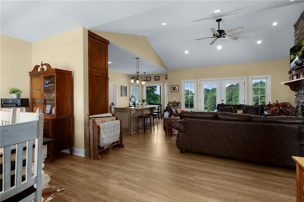 455 Poarch Farm Road Northeast Ranger, GA 30734 - Photo 40 of 93 a living room with furniture kitchen area and a wooden floor