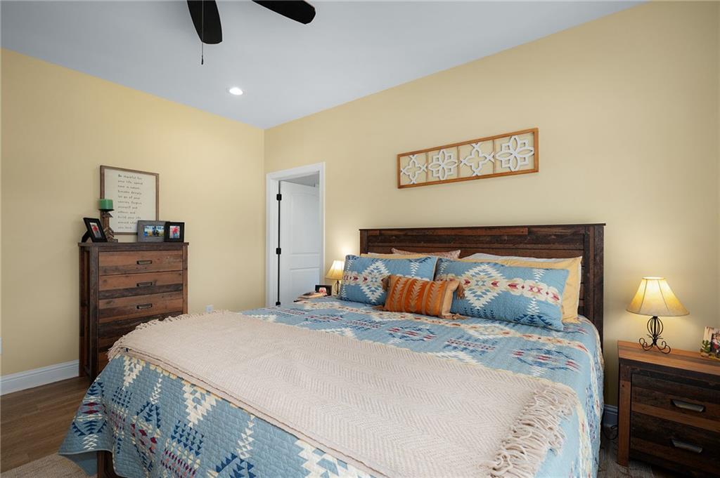 455 Poarch Farm Road Northeast Ranger, GA 30734 - Photo 71 of 93 a bedroom with a bed and wooden floor