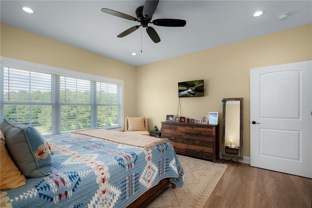 455 Poarch Farm Road Northeast Ranger, GA 30734 - Photo 72 of 93 a bedroom with a bed and a large window