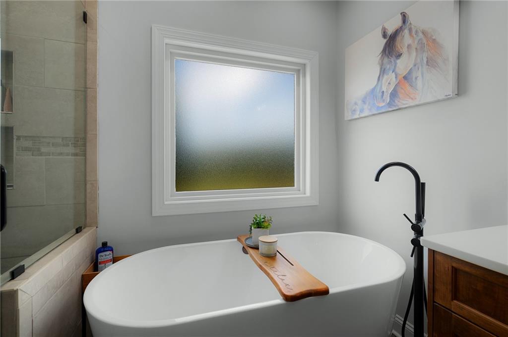 455 Poarch Farm Road Northeast Ranger, GA 30734 - Photo 75 of 93 a bathroom with a bathtub and a window