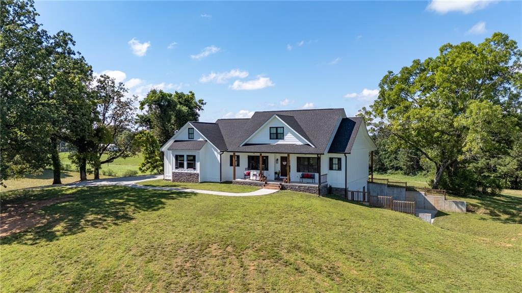455 Poarch Farm Road Northeast Ranger, GA 30734 - Photo 8 of 93 a front view of a house with a yard