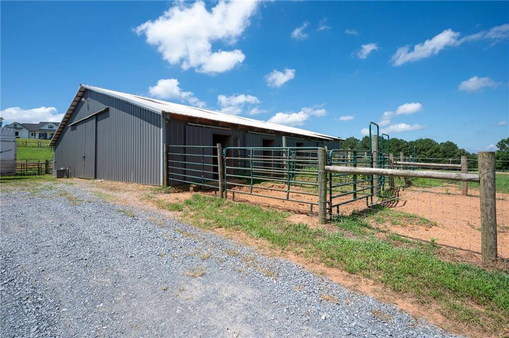 455 Poarch Farm Road Northeast Ranger, GA 30734 - Photo 89 of 93 a view of a backyard with floor to ceiling window and wooden fence