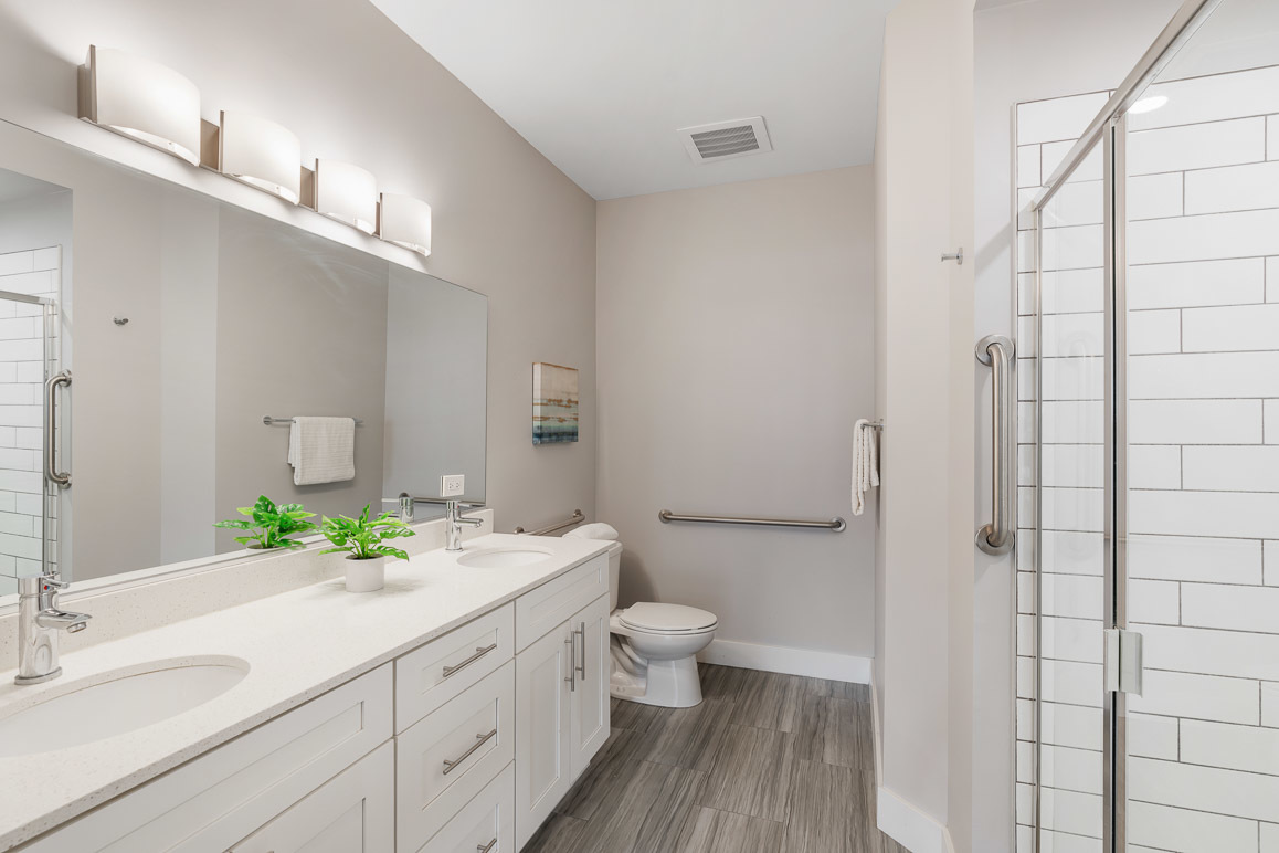 Undisclosed Address Barrington, IL 60010 - Photo 13 of 19 a bathroom with a double vanity sink toilet and shower
