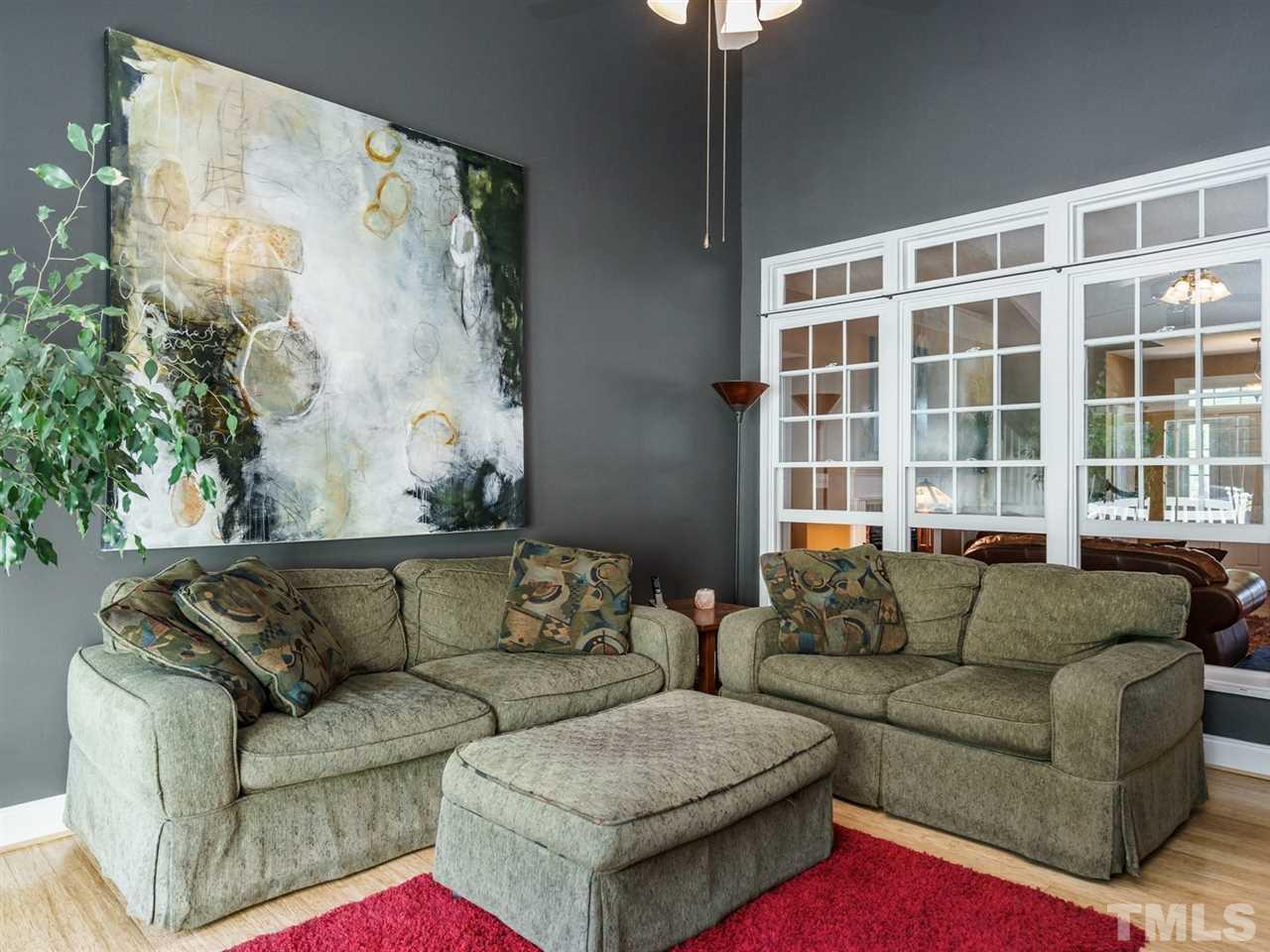 533 Rand Road Raleigh, NC 27603 - Photo 12 of 25 a living room with furniture and a large window