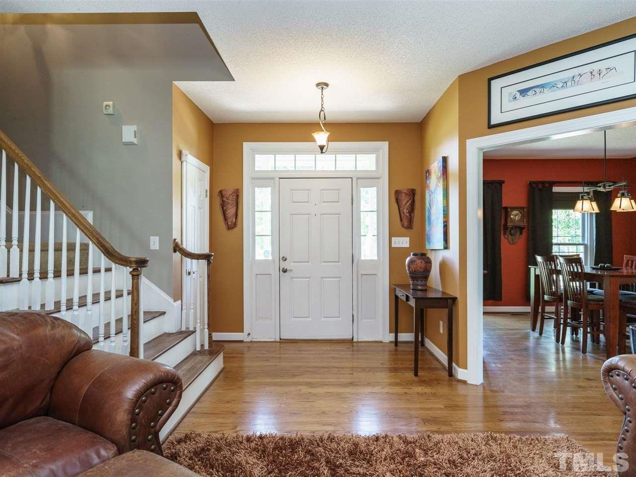 533 Rand Road Raleigh, NC 27603 - Photo 2 of 25 a living room with furniture and a chandelier