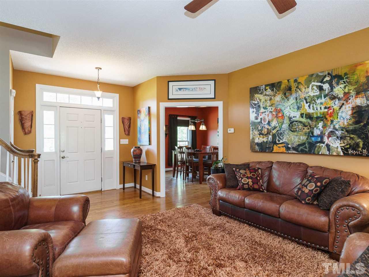 533 Rand Road Raleigh, NC 27603 - Photo 4 of 25 a living room with furniture and a large window