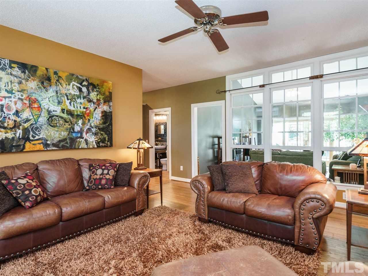 533 Rand Road Raleigh, NC 27603 - Photo 5 of 25 a living room with furniture and a large window