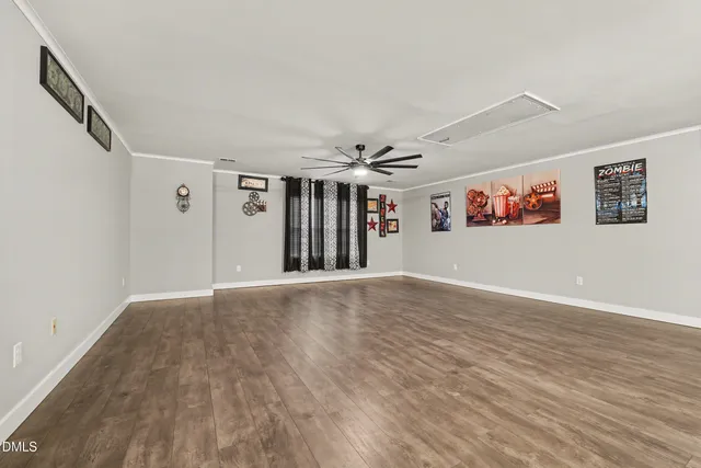 a living room with furniture and flat screen tv