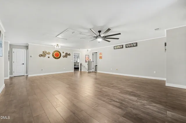 a bedroom with a bed flat screen tv and a couch
